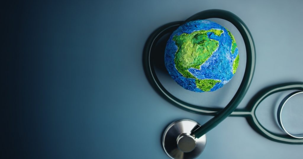 A globe and a medical item show how human health and the environment are linked.
