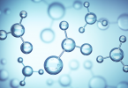 A slide shows the joining of chemical compounds.